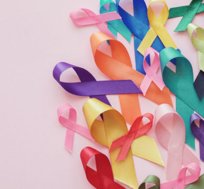 colorful ribbons on pink background, cancer awareness, World cancer day